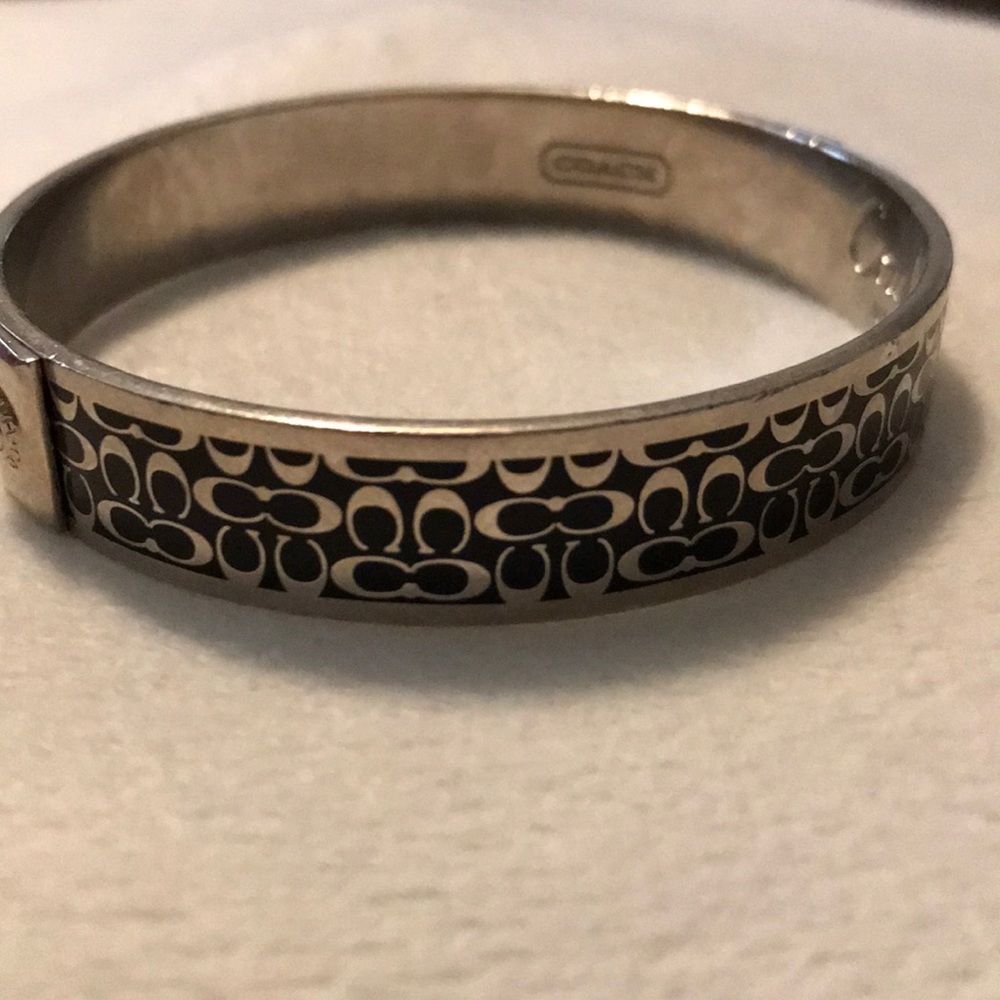 Black and silver tone signature coach bracelet